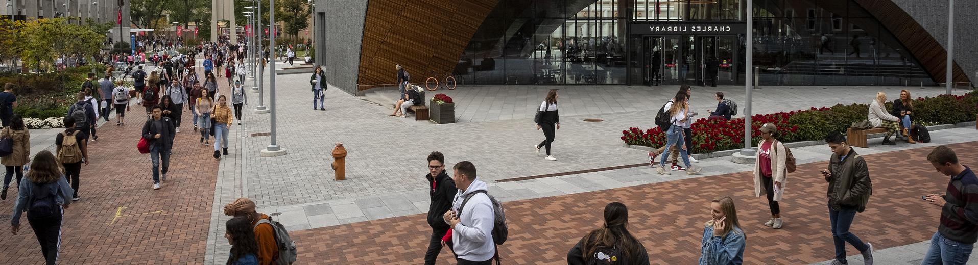 Students walk outside Charles Library on Main Campus